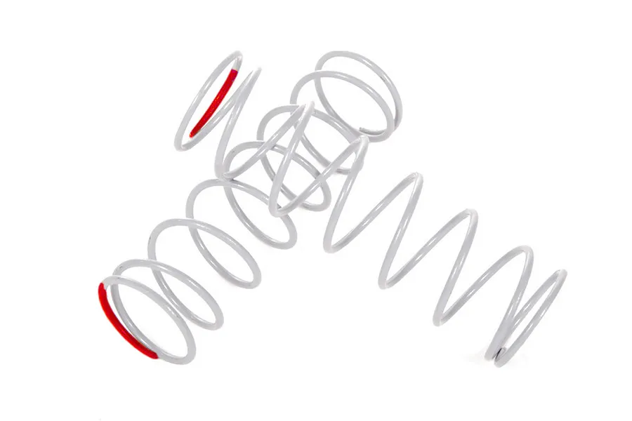 Two grey RC shock springs with red paint markings on the ends, positioned against a white background.