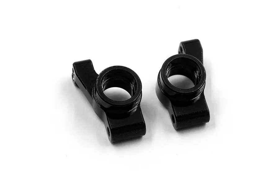 Two black aluminium RC rear hub carriers shown from an overhead angle against a white background.