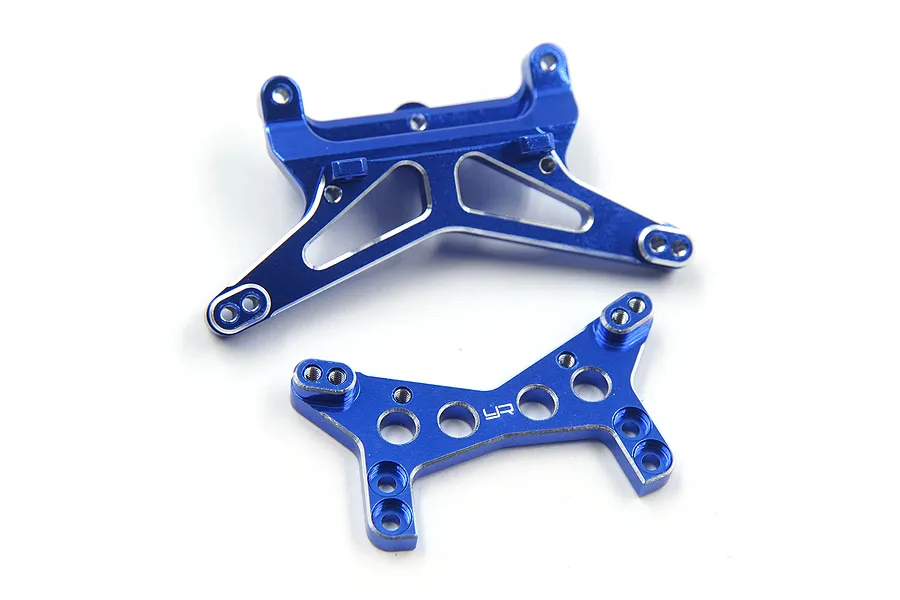 Two dark blue anodized aluminium RC shock towers from Yeah Racing on a white background.