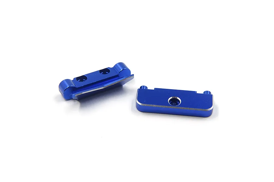 Two dark blue anodized aluminium suspension mounts for RC cars, shown from different angles on a white background.