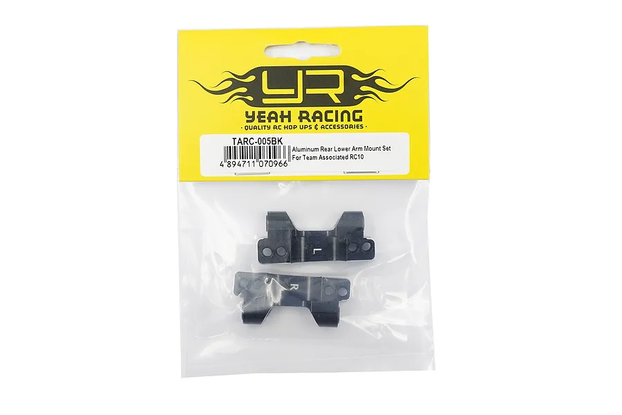 Yeah Racing black aluminium rear lower suspension arm mounts for Team Associated RC10 in original yellow and white retail packaging.