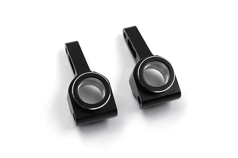 Two black anodized aluminium rear hubs for RC cars, shown from a top-down angle against a white background.