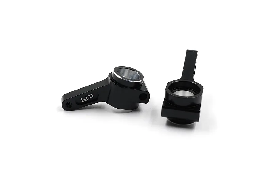 A pair of black anodized aluminium rear hubs for RC cars by Yeah Racing, featuring the YR logo engraved on the side.