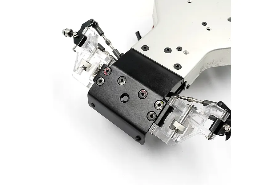 A black aluminium front bumper skid plate installed on the front of an RC car chassis.