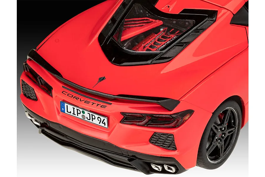 Rear view of a red Revell 1/25 scale Corvette C8 model car showing the engine bay, taillights, and license plate.