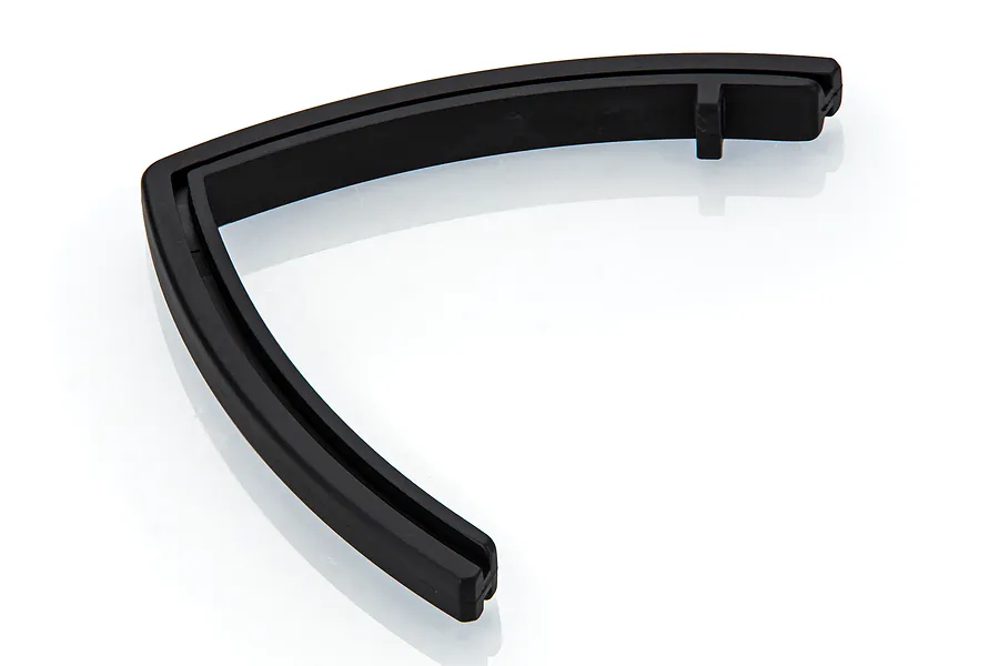 A black, V-shaped UDI RC boat front bumper or brace spare part isolated on a white background.