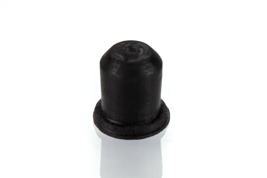 A single small black rubber plug for an RC boat, shown against a plain white background.