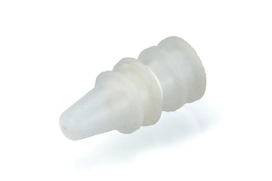 A small, translucent white silicone waterproof rod ring or seal for an RC boat, shown in a studio setting.
