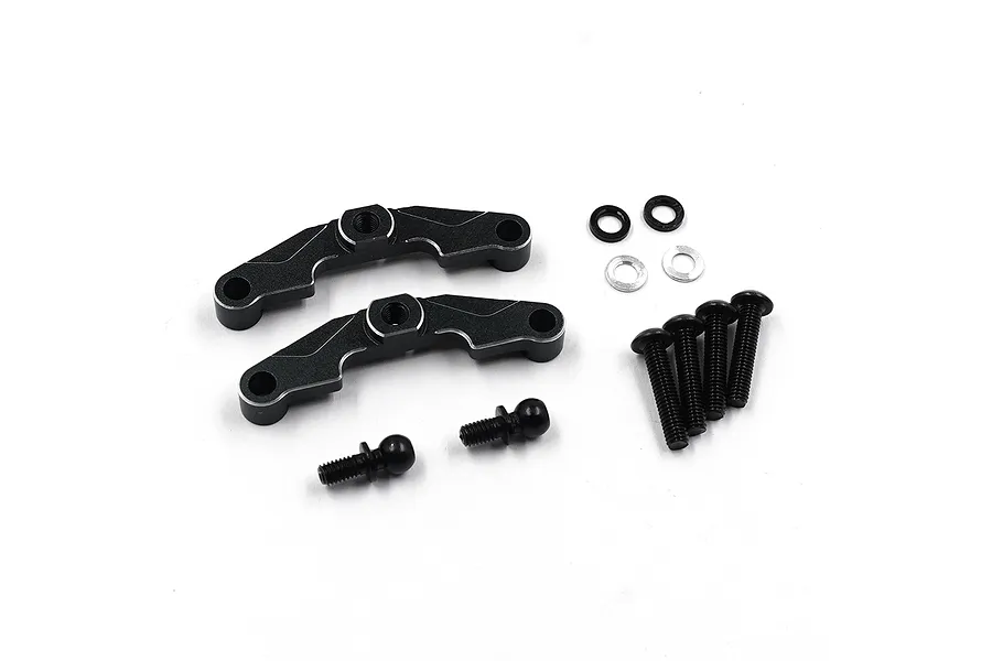 Yeah Racing black aluminium upper suspension arm mounts with included screws, ball studs, and washers on a white background.