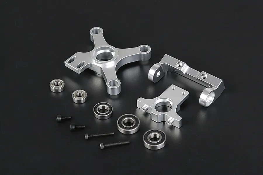 Rovan complete clutch mount set including silver alloy mounts, metal ball bearings, and black screws on a black background.