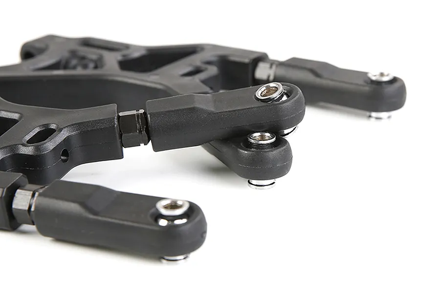 Close-up of black Rovan RC rear lower suspension arms with metal ball joints and plastic components.