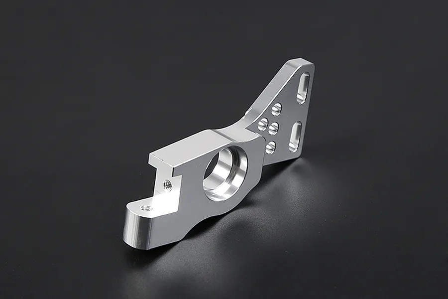 A silver Rovan aluminium first stage small gear mount for RC cars, shown from an angled perspective against a dark background.