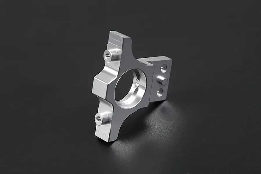 A silver Rovan aluminium first stage large gear mount shown from a side angle against a dark background.