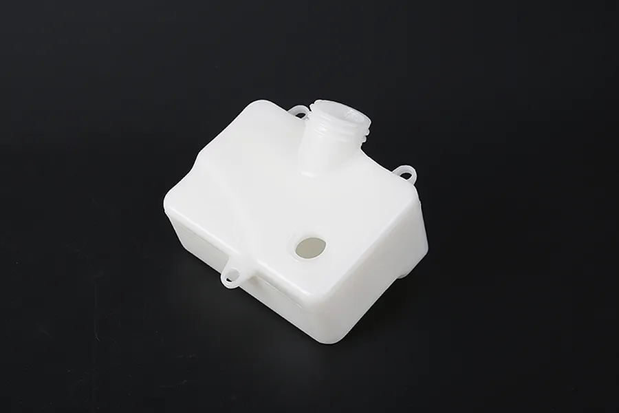 A white plastic RC fuel tank for Rovan engines, shown from a high angle against a black background.