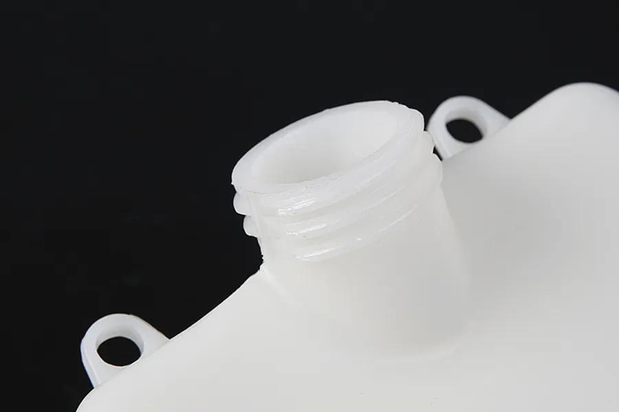 Close-up view of the threaded filler neck on a white plastic Rovan RC fuel tank against a black background.
