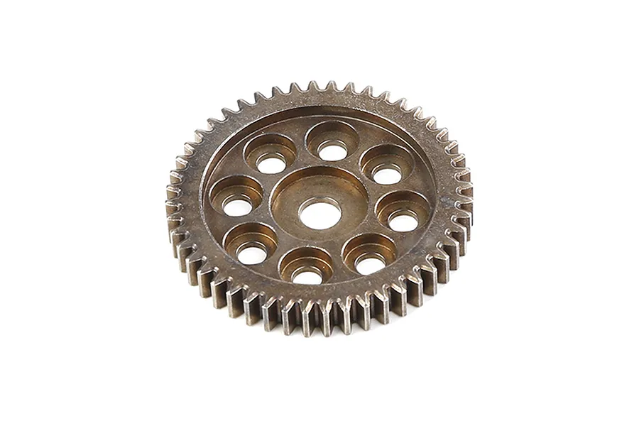 A bronze-coloured metal first stage reduction gear for an RC vehicle, featuring a circular design with multiple lightening holes and gear teeth.