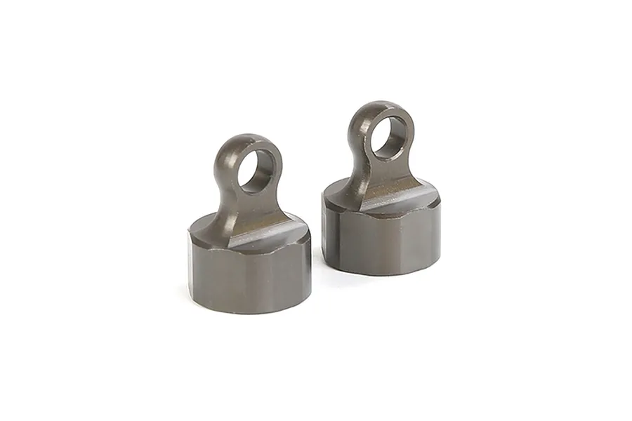 Two gunmetal grey aluminium RC shock caps with mounting eyelets, shown against a plain white background.