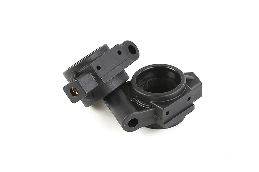 Two black plastic rear hub carriers for an RC vehicle, shown from a high angle against a white background.