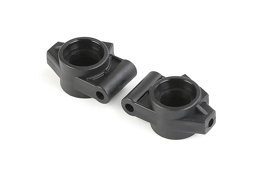 Two black plastic rear hub carriers for an RC vehicle, shown from a high-angle perspective against a white background.