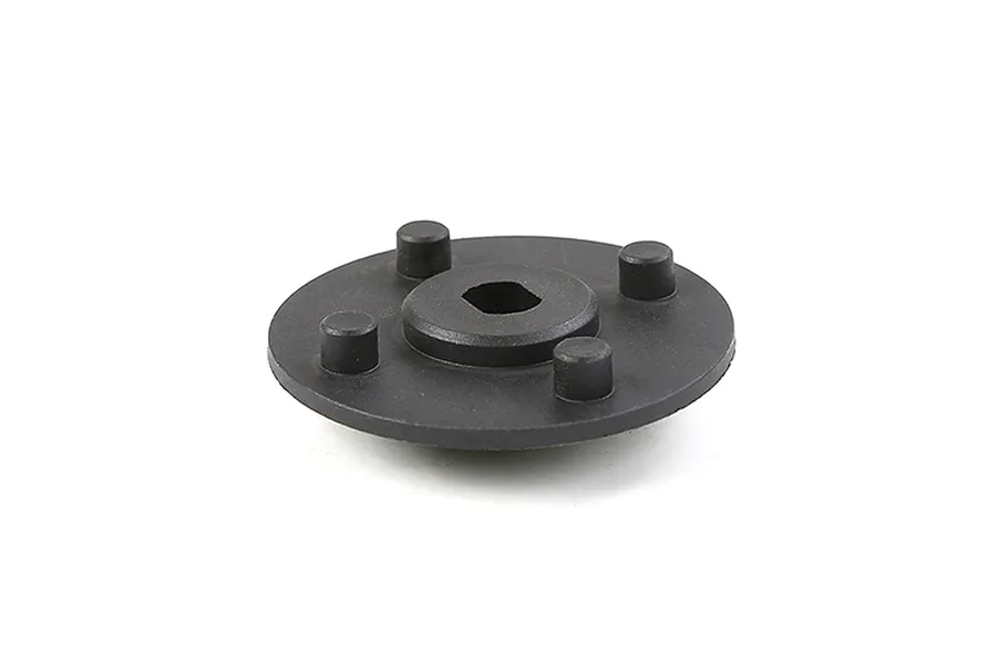 A black Rovan secondary gear mount featuring a central hexagonal hole and four protruding mounting pegs on a white background.