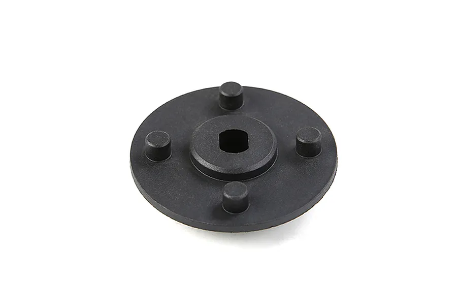 A black circular Rovan secondary gear mount with four mounting pegs and a central hexagonal hole on a white background.