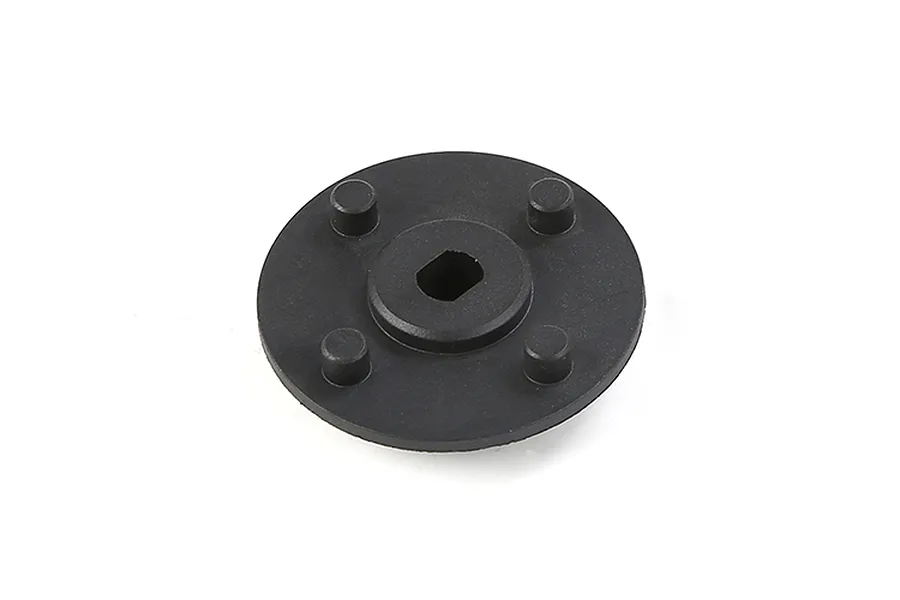 A black circular Rovan secondary gear mount with four small cylindrical pegs and a central square-shaped hole.