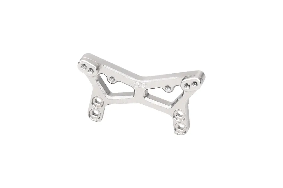A silver GPM Racing aluminium front shock tower for an RC car, featuring multiple mounting holes and a machined design.