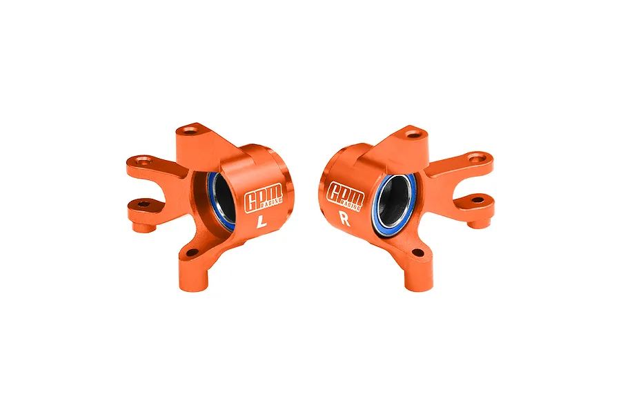Two orange anodized aluminium front steering hubs for RC cars by GPM Racing, featuring pre-installed bearings and L/R markings.