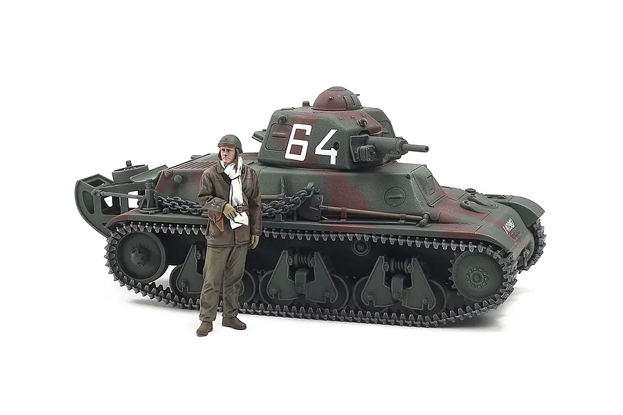 A 1/35 scale Tamiya French H39 light tank model with a painted crew figure standing in front of it against a white background.