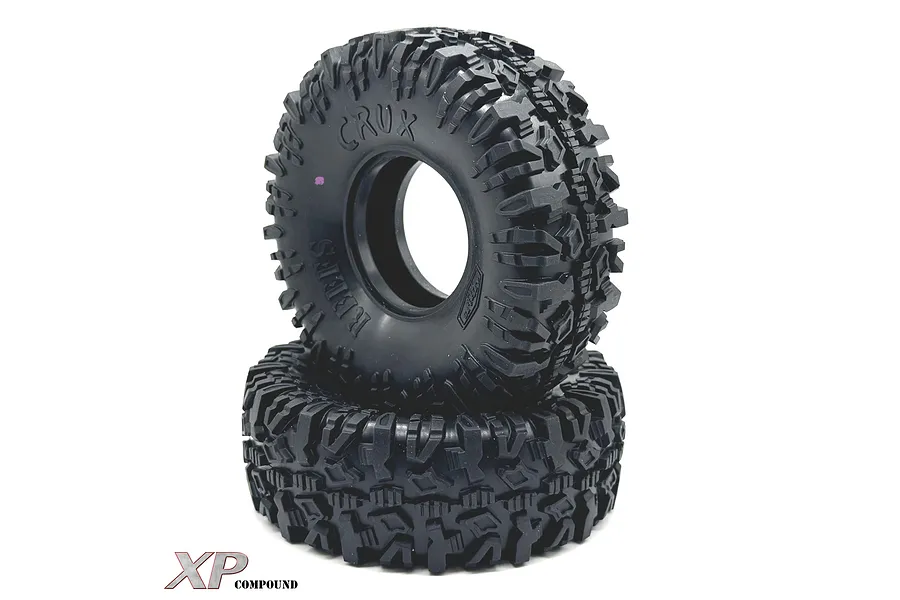Two black Reefs RC 1.9 inch Crux crawler tyres stacked on a white background, featuring aggressive tread patterns and embossed branding.