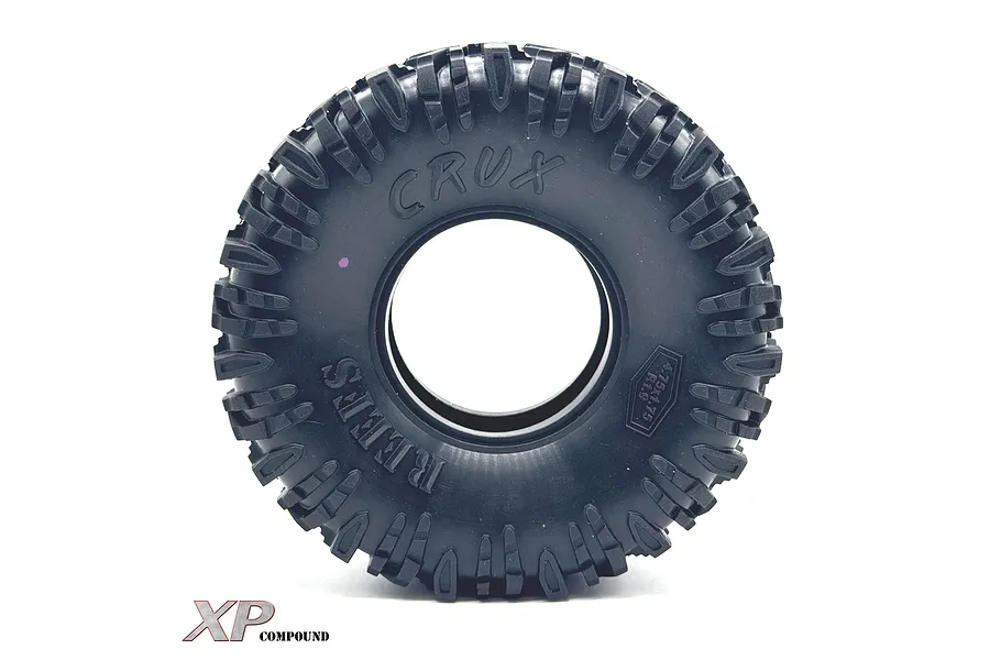 A single black Reefs RC 1.9 inch Crux crawler tyre with aggressive tread pattern and embossed branding on a white background.