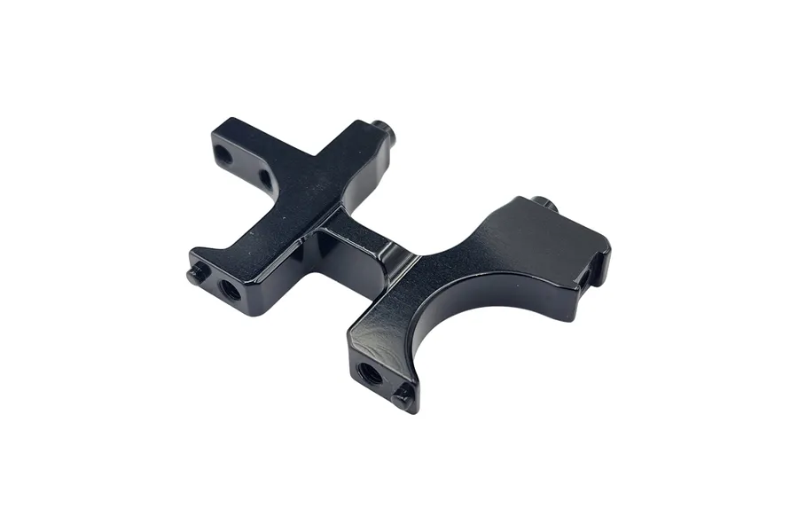 A black anodized aluminium RC car bulkhead component shown from a high-angle perspective against a white background.