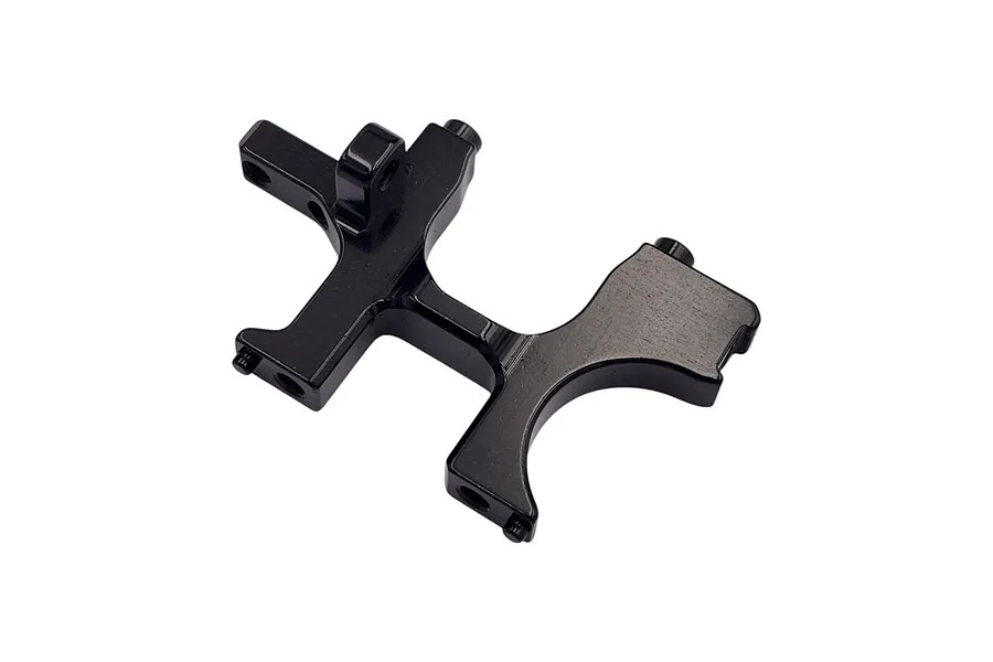 A black anodized aluminium RC car bulkhead component with mounting holes and a curved profile, isolated on a white background.