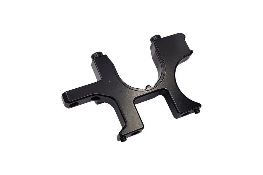A black anodized aluminium RC car bulkhead part, viewed from an angle against a white background.