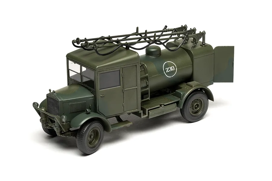 A completed 1/48 scale Airfix Albion 3-Point Fueller model truck painted in a green military camouflage scheme against a white background.