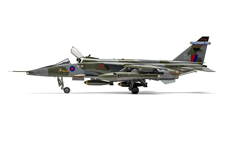 A side-profile view of a fully assembled and painted 1/48 scale SEPECAT Jaguar GR.1 model aircraft, featuring camouflage paint and detailed markings.