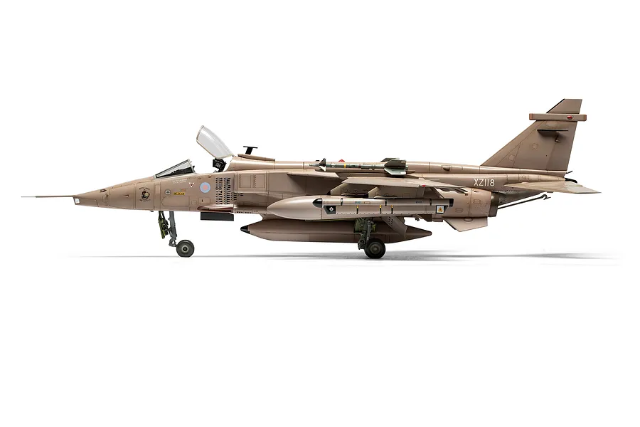 A side profile view of a fully assembled and painted 1/48 scale SEPECAT Jaguar GR.1 model aircraft in a desert camouflage scheme.