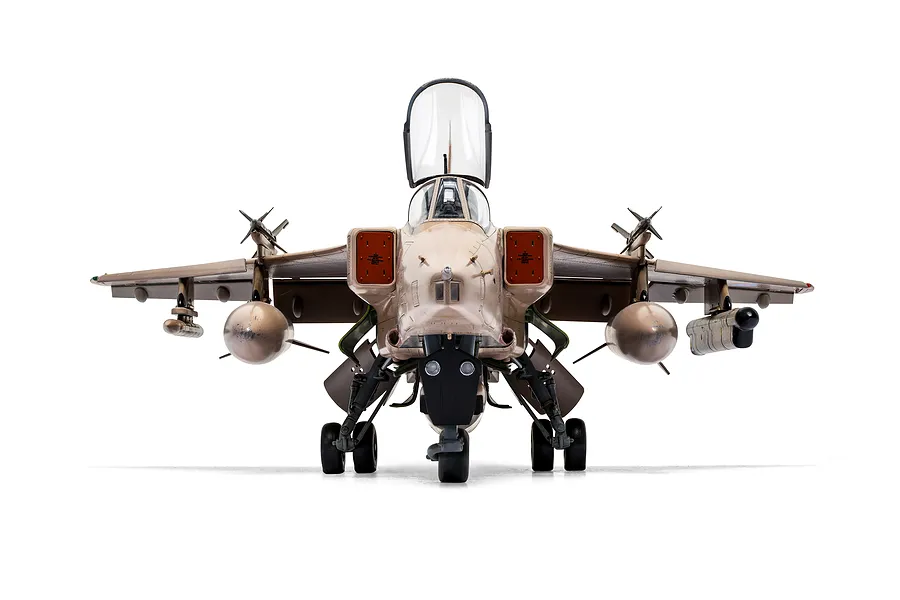 Front view of a 1/48 scale model of a SEPECAT Jaguar fighter jet, featuring a desert camouflage paint scheme and open cockpit canopy.