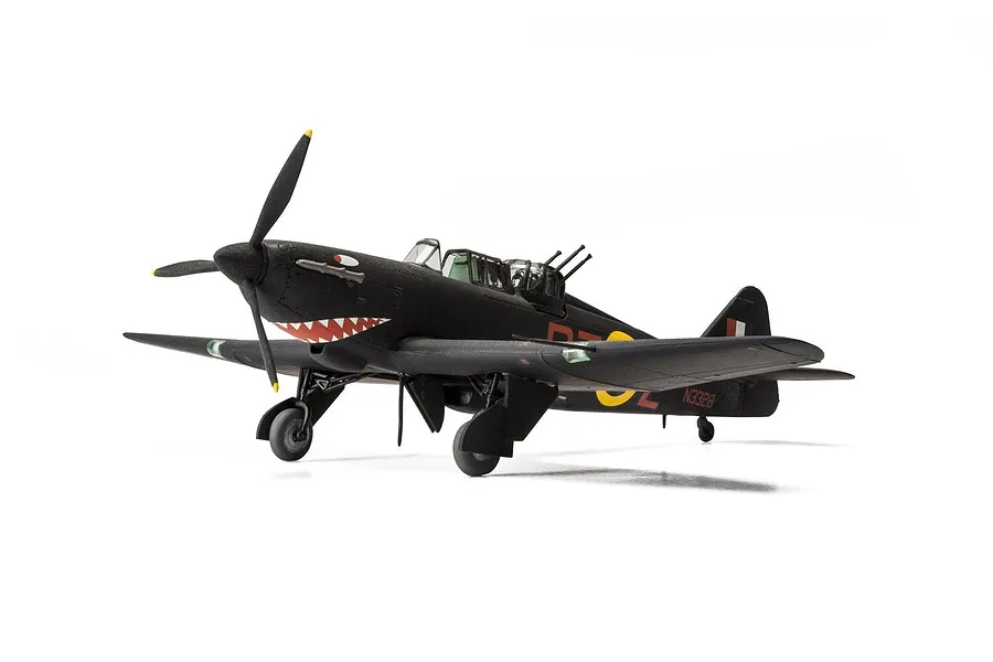 A completed 1/48 scale model of a Boulton Paul Defiant NF.1 fighter aircraft painted in black with shark mouth nose art, set against a white background.