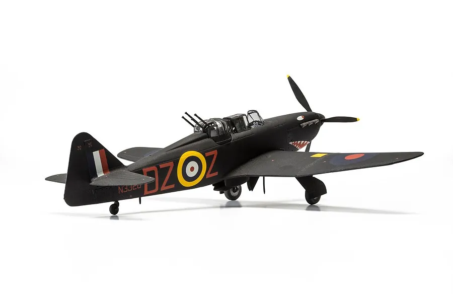 A completed 1/48 scale model of a black Boulton Paul Defiant NF.1 night fighter with RAF markings and shark mouth nose art.