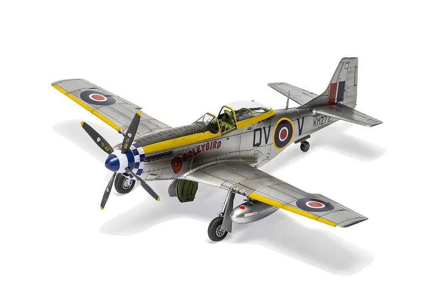 A fully assembled and painted 1/48 scale model of a North American Mustang Mk.IV fighter plane, featuring silver finish and RAF markings.