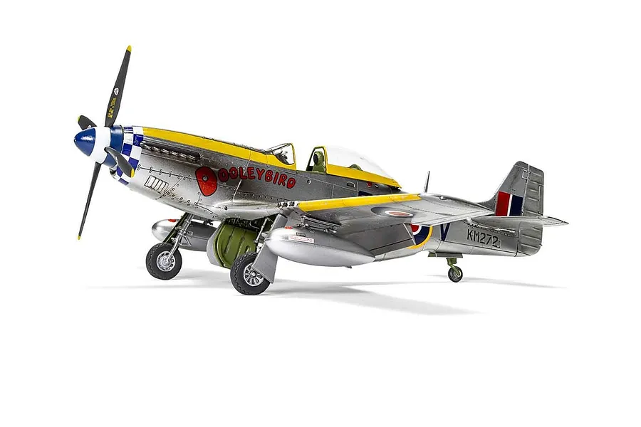A fully assembled and painted 1/48 scale model of a North American Mustang Mk.IV fighter plane, featuring a silver body with yellow accents and 'Dooleybird' markings.