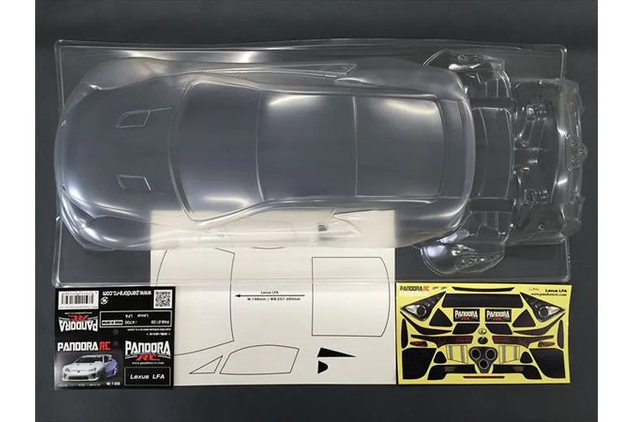 An unpainted clear polycarbonate Lexus LFA RC body shell in its plastic packaging, accompanied by a decal sheet and instruction mask sheet.