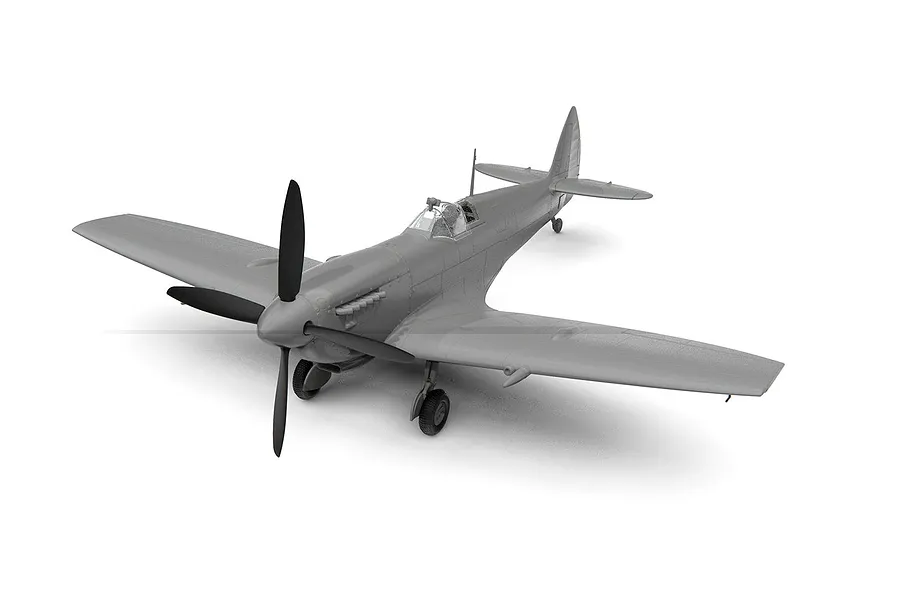 An assembled, unpainted grey plastic model of a Supermarine Spitfire Mk.IXe fighter aircraft on a white background.