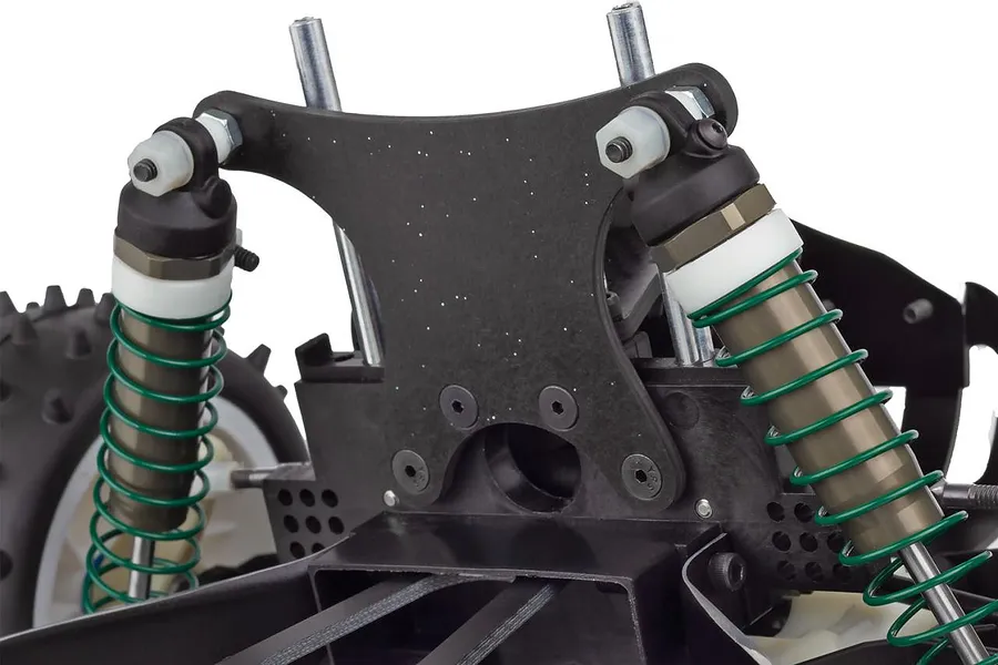 Close-up of the rear shock tower and suspension assembly on a Team Associated RC10 buggy.