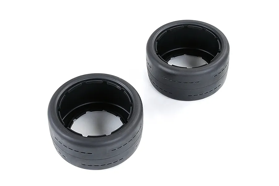 Two black Rovan RC buggy slick rear tyres viewed from an angle against a white background.
