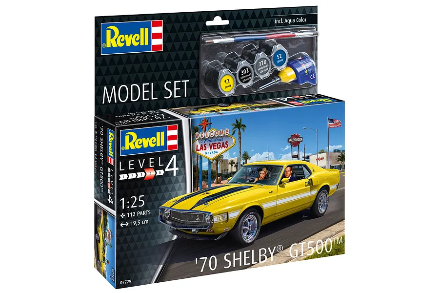 Revell 1/25 scale 1970 Shelby Mustang GT500 model car kit box showing a yellow car in Las Vegas and included paints and glue.
