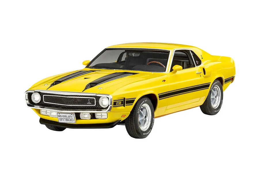 A yellow 1970 Shelby Mustang GT500 scale model car with black racing stripes on a white background.