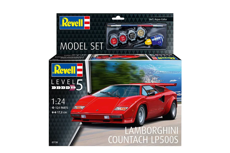 Revell 1/24 scale Lamborghini Countach LP500S plastic model kit box showing a red car on a coastal road with included paints and glue.