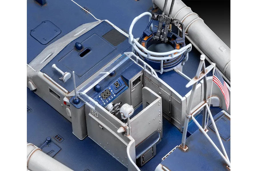 A high-angle close-up of a detailed 1/72 scale plastic model of a PT-160 patrol torpedo boat, showing the cockpit, gun turret, and US flag.